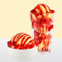 Tropical Paradise · Non-dairy Piña Colada sorbet, fresh sliced strawberries, and strawberry sundae sauce.