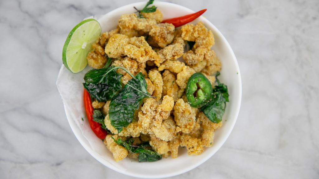 Crispy Popcorn Chicken · Chicken bites fried to perfect crispiness-seasoned with flavorful pepper mix and basil leaves.