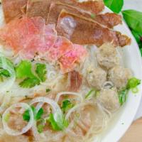  Pho Special · Eye Round Steak, Brisket, Tendon, Beef Balls.
Rice stick noodles in beef broth topped with c...