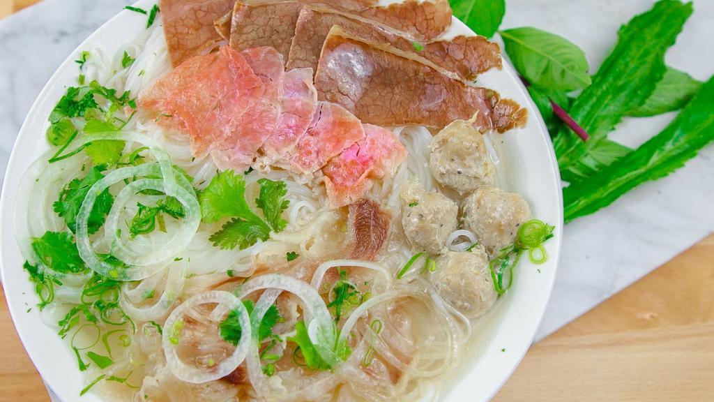  Pho Special · Eye Round Steak, Brisket, Tendon, Beef Balls.
Rice stick noodles in beef broth topped with cilantro, scallion, and white onion.