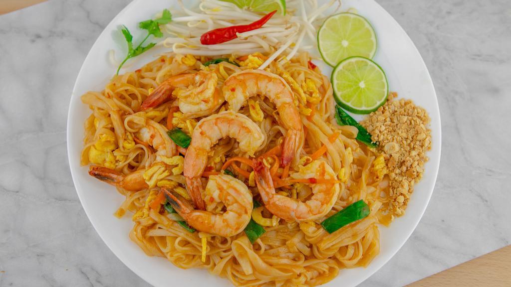 Shrimp Pad Thai · Flat rice noodles stir-fried in sweet and tangy Pad Thai sauce, egg and shrimps. Served with crushed peanut, bean sprouts, and lime.