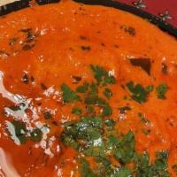Chicken Tikka Masala · The most popular Indian dish, cooked in mildly spiced tomato onion gravy with green peppers,...