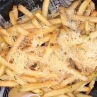 Truffle Fries · Grated parmesan, mojito herbs, and truffle oil.