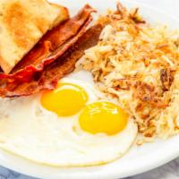 Two Eggs · Served with bacon, hash browns and wheat toast.