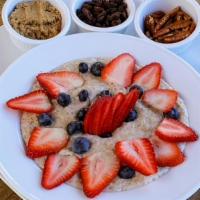 Oatmeal · Steel cut oats soaked in coconut milk and served with fresh berries.