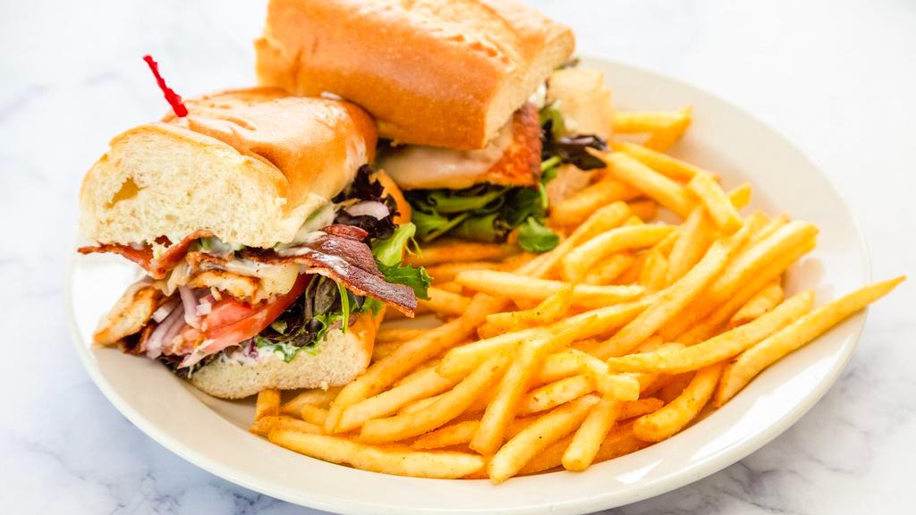 Chicken Breast Sandwich · Soft French roll with bacon, avocado, tomato, greens, mozzarella and ranch, served with French fries.