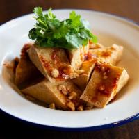 Crispy Tofu · Deep-fried tofu served with sweet chili sauce, cilantro, and minced peanuts!