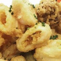 Fritto Misto Di Pesce · golden fried calamari, rock shrimps and zucchini served with a spicy tomato sauce
