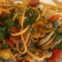 Spaghetti All'Aragosta E Arugola · Spaghetti with Main lobster and fresh wild arugula in a lite spicy tomato sauce