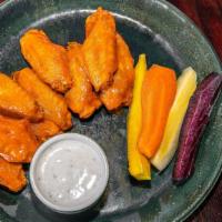 Chicken Wings · All flats. Ten pieces. Lemon pepper rub, BBQ buffalo, sweet chili-ginger or buffalo.