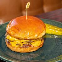 Double Cheeseburger · American cheese, onions, garlic aioli, ketchup, pickle, brioche bun.