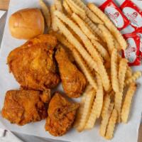 Golden Fried Chicken Dinner · Half golden fried chicken served with french fries and a roll.