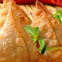 Samosa · Vegetable masala stuffed in a flanky pastry shell and deep fried.