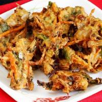 Mix Veg Pakora · Shredded farm fresh spring vegetable mixed with basin flour and deep fried. Served with spic...