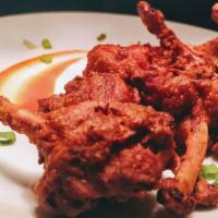 Chicken Lollipop (5 Pcs) · Chicken wings marinated in a house special sauce and deep fried. Garnished with onion and le...