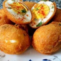 Egg Bonda · Boiled egg dipped into batter and deep fried. Served with mint and sweet chutney.