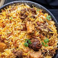 Goat Biryani - Family Pack · A mixture of aromatic Basmati rice, Indian herbs, succulent pieces of goat meat cooked in th...