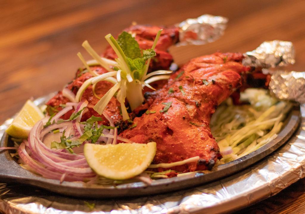 Tandoori Chicken · A classical Indian dish marinated delicately and cooked in traditional style served on the bone.