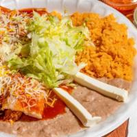 Enchiladas · 2 enchiladas, chicken or ground beef, rice, beans, and cheese.