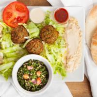 Falafel Plate · Vegan. A delicious mixture of garbanzo beans, herbs, and spices served with tahini, lettuce,...