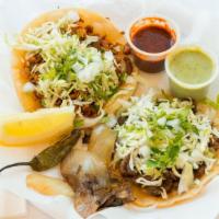 4 Tacos  · 4 tacos (street size tacos) served with cabbage, cilantro & onions