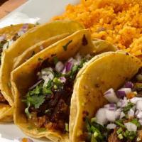 4 Tacos Combo · 4 tacos (street size tacos) served with rice & beans, topped cabbage, cilantro & onions.