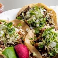 3 Tacos  · 3 tacos street taco size served with cabbage, cilantro & onions(salsas served up on request)
