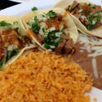 3 Tacos Combo · 3 tacos (street taco size) Served with rice and beans
topped with cabbage, cilantro & onions