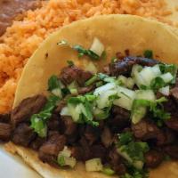 2 Tacos Combo · 2 tacos (street taco size) Served with rice and beans
topped with cabbage, cilantro & onions