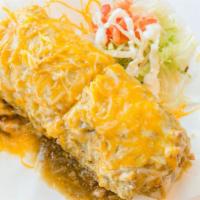 Burrito Mojado · meat, rice, beans, cilantro, onions. Topped with chile verde sauce & melted cheese