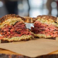 Pastrami Reuben · Hot pastrami, Swiss cheese, thousand island dressing, and your choice of coleslaw or sauerkr...