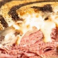 Corned Beef Reuben · Corned beef, Swiss cheese, thousand island dressing, and your choice of coleslaw or sauerkra...