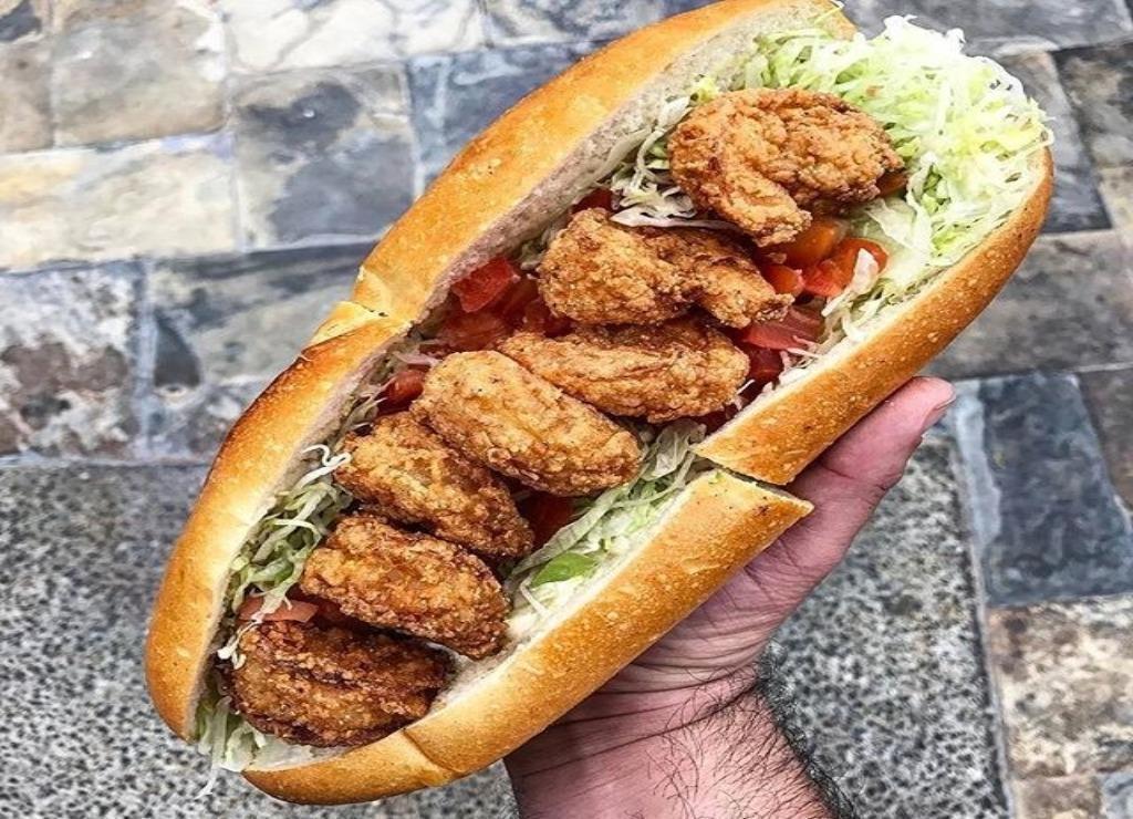 Shrimp Po'Boy · Jumbo breaded shrimp, lettuce, tomatoes, and spicy mayo. Served on French Baguette.