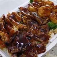Super Combo · Shrimp, chicken, and beef topped with your choice of teriyaki sauce or hot garlic sauce alon...