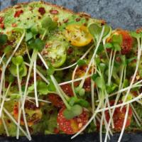 The Avocado Toast · Served open-faced, heirloom cherry tomato, chili peppers, olive oil, sea salt and sprouts on...