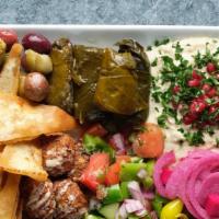 Mediterranean Platter · Grape leaves, falafel, olives, hummus, baba ganoush, couscous, cucumber, tomatoes, pickled t...