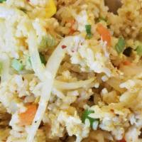 Curry Fried Rice · Pan-fried jasmine rice with egg, green pea, and carrot and house curry powder.