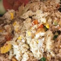 Crab Fried Rice · Thai jasmine rice stir-fried with crab meat, egg, onion, pea, carrot & scallion.