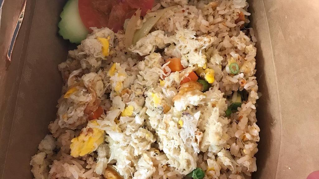 Crab Fried Rice · Thai jasmine rice stir-fried with crab meat, egg, onion, pea, carrot & scallion.