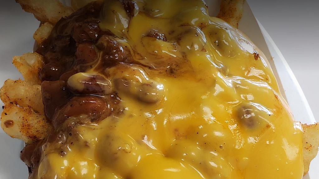 Chili Cheese Fries · Crispy fries topped with chili and cheddar cheese.