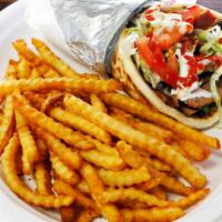 Beef&Lamb · Beef and lamb gyro with lettuce, tomato, onion, white sauce, and a fresh pita.