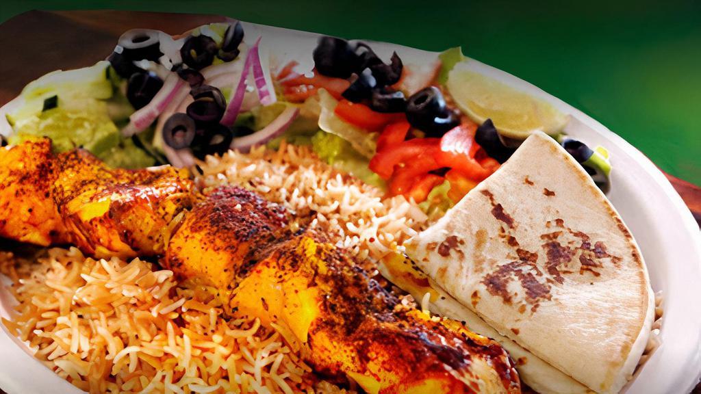 Chicken Kabob · Boneless chicken breast marinated 48 hours prior with special homemade spices served with rice and salad.
