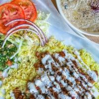 Chicken Shawerma Plate · Marinated chicken slices cooked to perfection and mixed up with tomatoes, red onions and par...