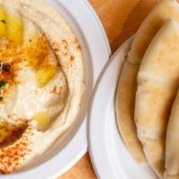 Hummus · Chickpeas dip comes with a pita bread.
