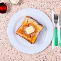 French Toast · Four thick slices of egg-washed cinnamon toast with maple syrup.