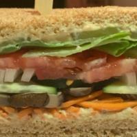 Vegan Sandwich · Smoked Crimini Mushroom marinated in Vegetable Broth - Cucumber, Shredded Carrots
and Hummus...