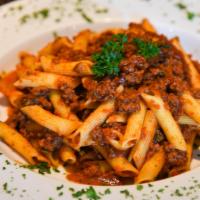 Penne With Meat Sauce · Small chunks of ground beef, celery, basil, garlic in tomato sauce.