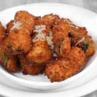 Zucchini Sticks · Eight breaded zucchini sticks made from scratch daily in our kitchen and fried. Served with ...