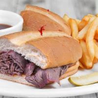 French Dip Sandwich · Thinly sliced roast beef on a French roll with au jus.
