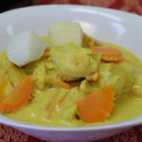 Yellow Curry · Choice of meat cooked in yellow curry sauce with potatoes carrots and onions.